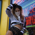 A sparkling silver rhinestone flash jewelry mask worn over the nose and mouth showcasing explosive metal flash design