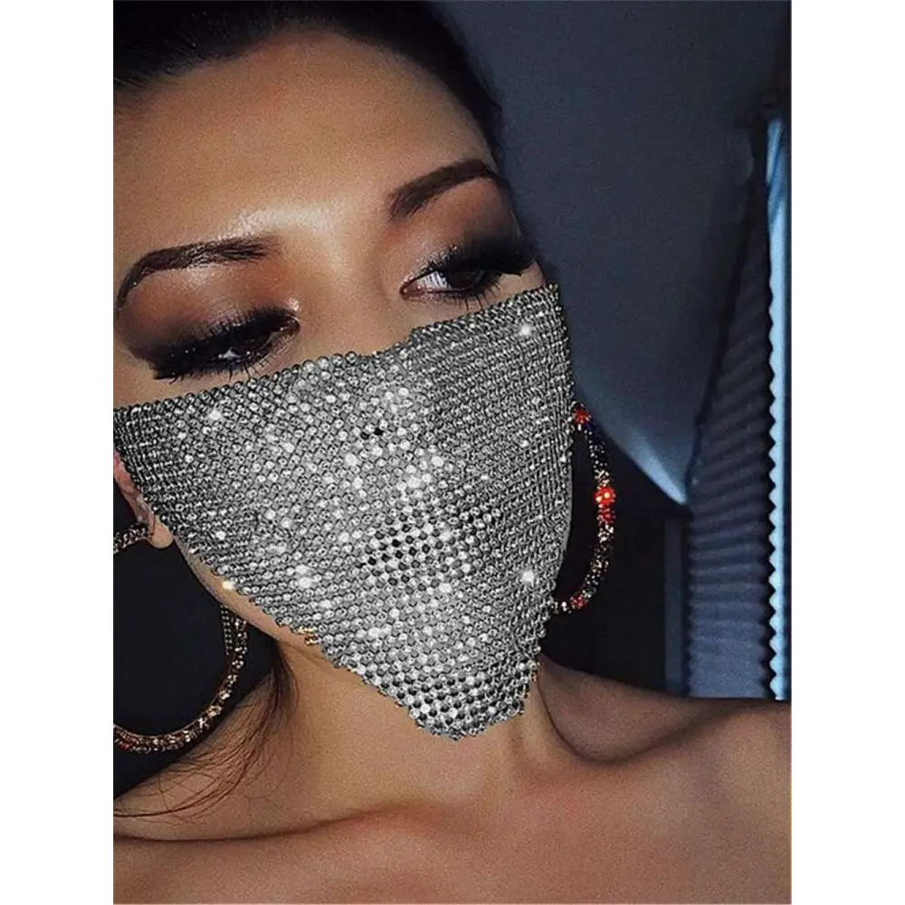 A sparkling silver flash jewelry mask with a gold rhinestone explosive metal flash diamond pattern design