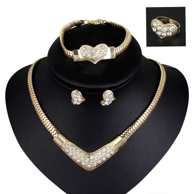 Gold-toned heart and v-shaped wedding party jewelry set with sparkling clear rhinestones for bridal wedding party