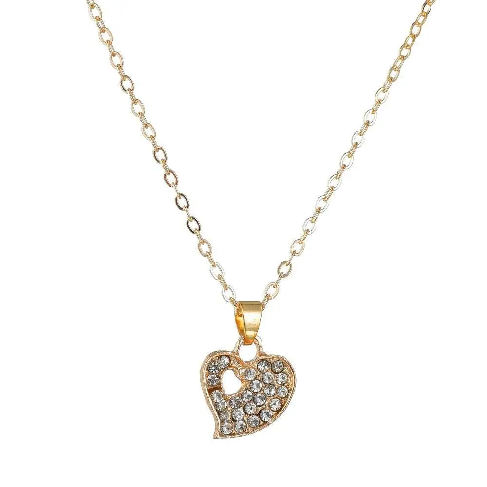 Gold rhinestone heart love jewelry set featuring a gold-toned heart necklace and bangle with sparkling rhinestones