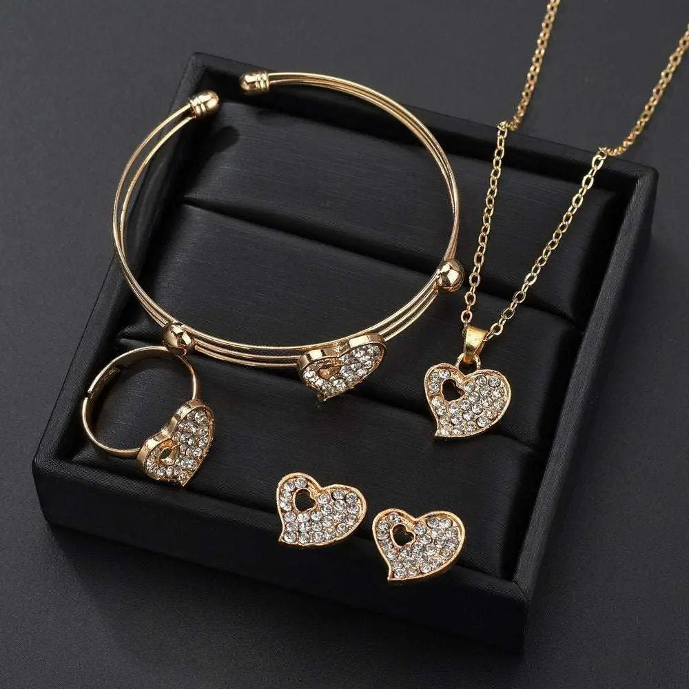 Gold rhinestone heart love jewelry set featuring a gold-toned heart necklace and bangle with sparkling rhinestones