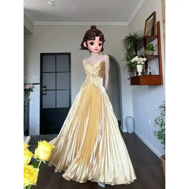 A shimmering gold satin heavy industry birthday dress featuring a pleated ball gown with fitted bodice and flowing skirt