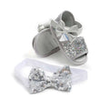 Silver sequined baby shoes princess sandals with matching bow accents and white elastic headband for infants