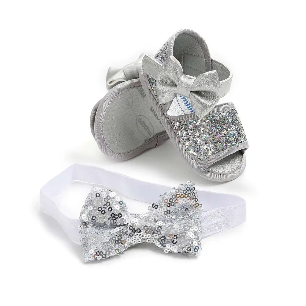Silver sequined baby shoes princess sandals with matching bow accents and white elastic headband for infants