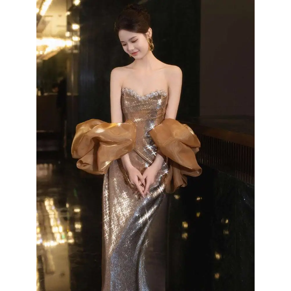 Gold sequined banquet temperament evening dress with strapless silhouette and voluminous satin puff sleeves