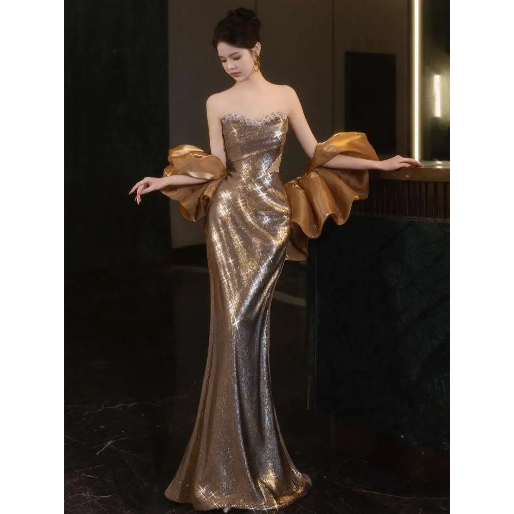 Gold sequined banquet temperament evening dress featuring a shimmering mermaid gown with voluminous sleeves