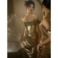 A gold sequined off-shoulder dress bridal fishtail gown with a fitted bodice and flowing skirt for toast dress bridal events