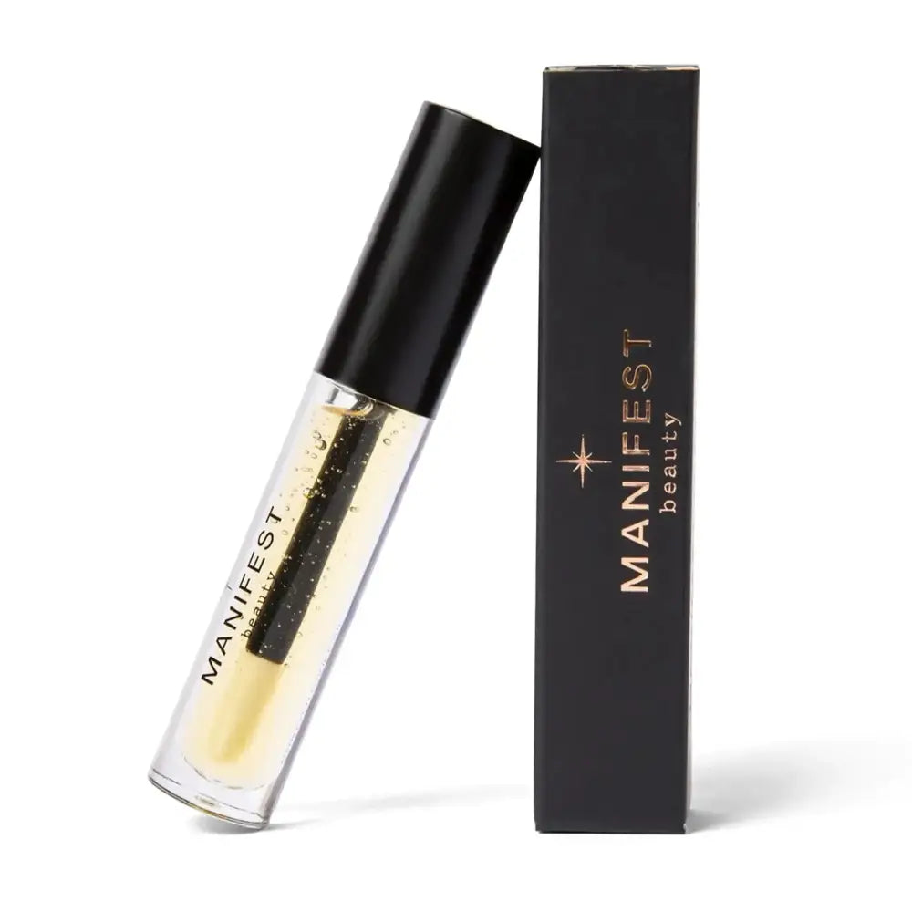 A sleek black-capped transparent tube of gold shimmer chili infused lip plumping oil with vertical brand name print