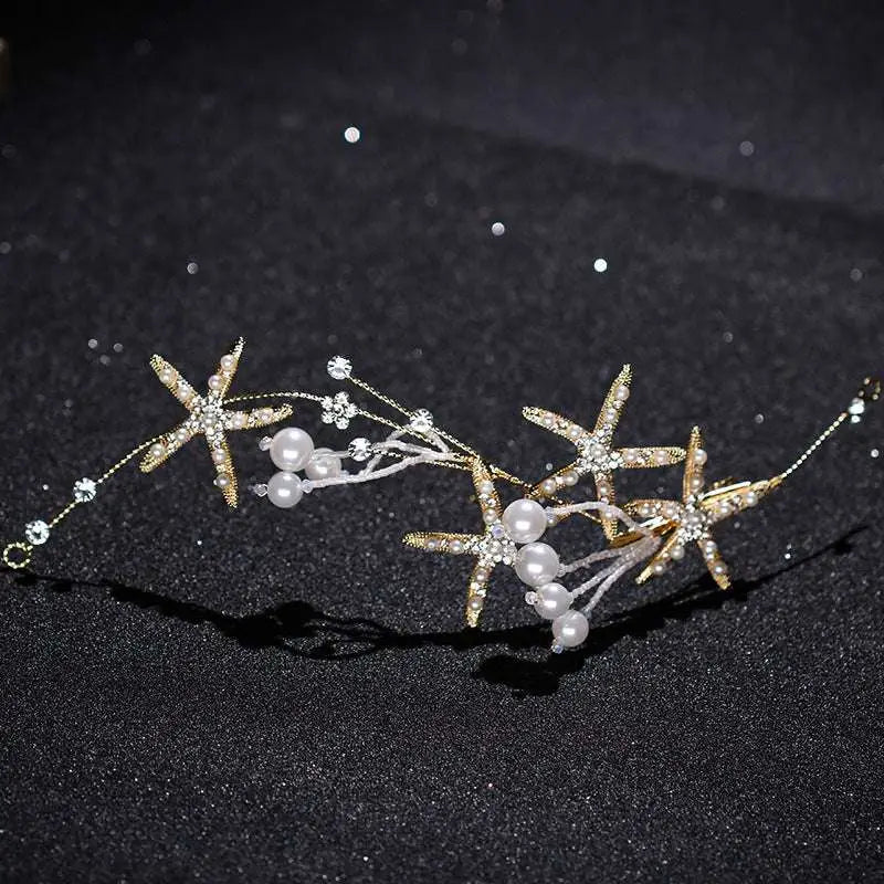 Gold-toned starfish pearl hair accessory adorned with sparkling crystals and white pearls for elegant styling