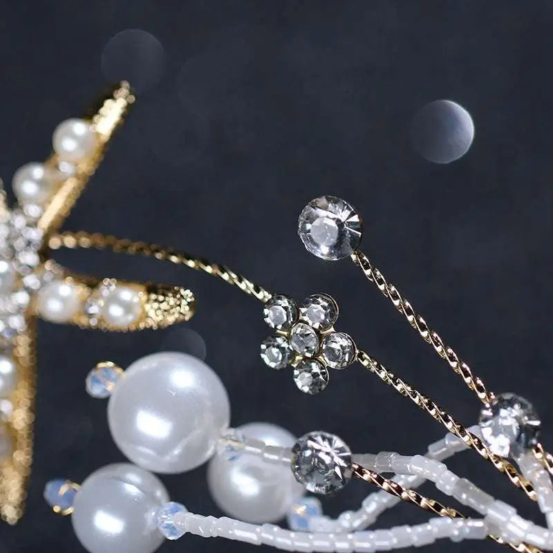 Gold-toned starfish pearl hair accessory adorned with sparkling crystals white pearls and delicate beaded chains