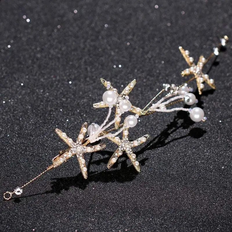 Delicate gold-toned starfish pearl hair accessory adorned with pearls and sparkling crystals for elegant styling