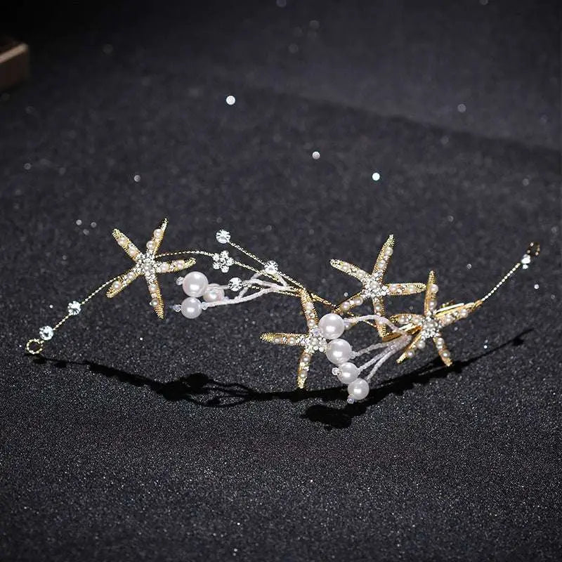 Gold-toned starfish pearl hair accessory adorned with sparkling crystals and white pearls for elegant styling