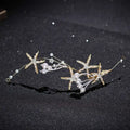 Gold-toned starfish pearl hair accessory adorned with sparkling crystals and white pearls for elegant styling