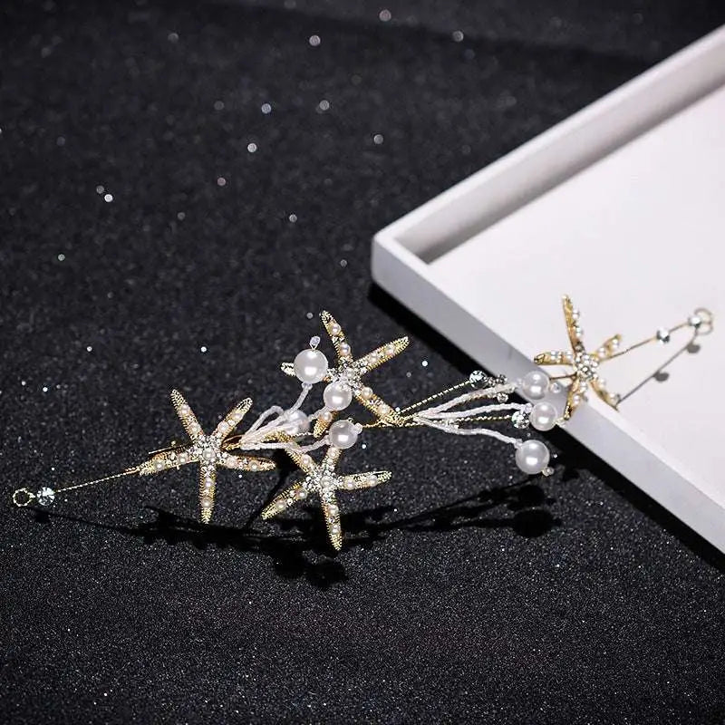 Delicate gold-toned starfish pearl hair accessory adorned with sparkling crystals and soft white pearls