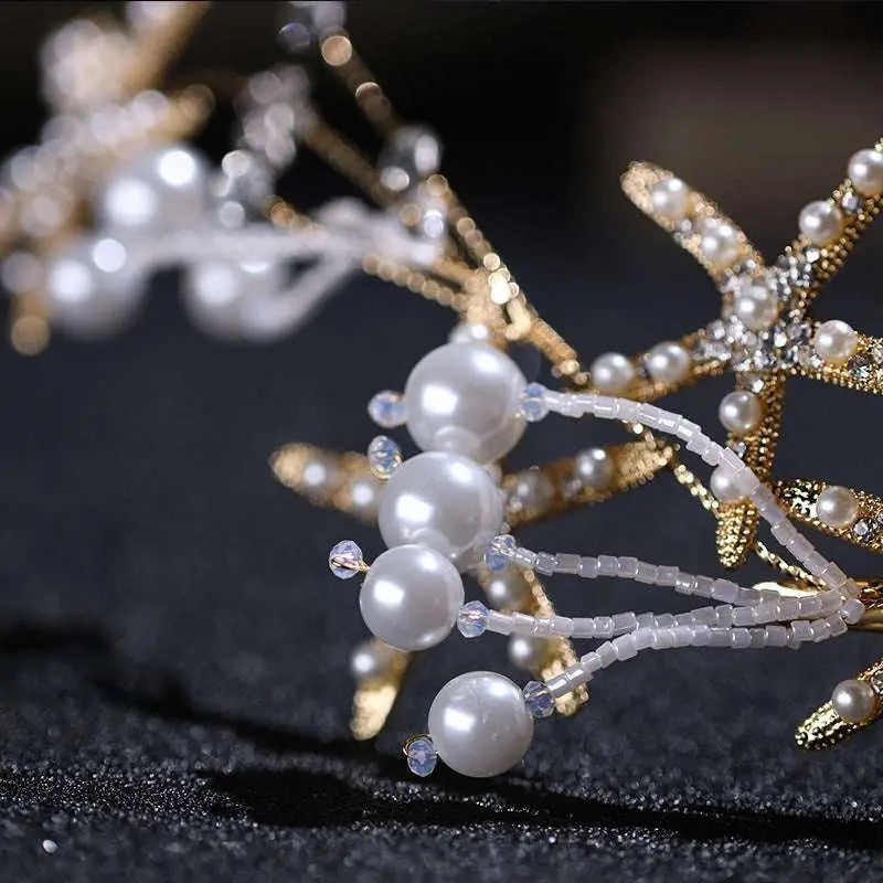 Gold-toned starfish pearl hair accessory adorned with sparkling crystals and white pearls for elegant styling