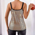 A shimmering gold summer sequined suspender chain vest top with black straps and a fitted silhouette