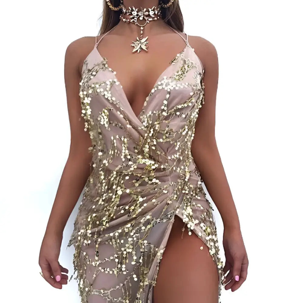A shimmering gold v neck strap sequin dress with halter straps and a high slit for elegant occasions