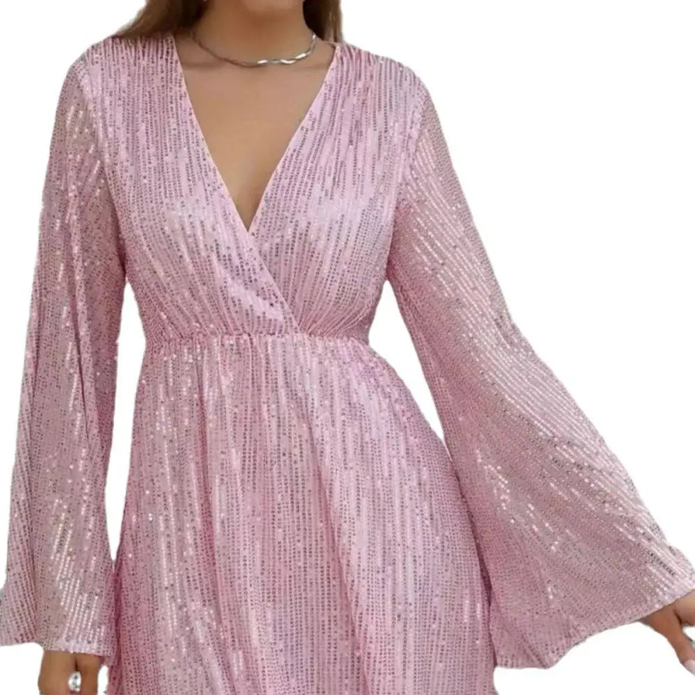 A shimmering pink sequined slimming senior party dress with sequin waist slimming detail and long bell sleeves