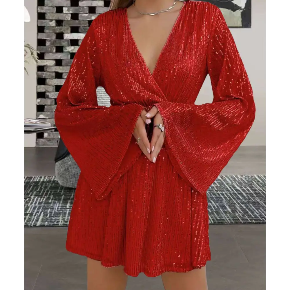 A vibrant red long-sleeved sequined mini dress with deep v-neck and bell sleeves for slimming senior party use