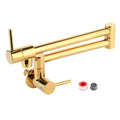 Gold wall mounted single hole kitchen faucet with gold metallic finish, extendable spout, and dual handles for water control