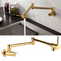 Gold wall mounted single hole kitchen faucet in gold with extendable two-handle design and sleek metallic finish