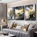 Three-panel golden black abstract wall art featuring flowing gold and black liquid patterns in sleek black frames