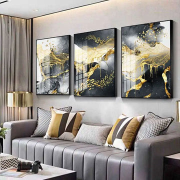 Three-panel golden black abstract wall art featuring flowing gold and black liquid patterns in sleek black frames
