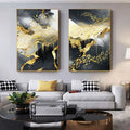 Two matching golden black abstract wall art posters featuring white swirling patterns in thin golden lines on dark background