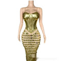 A shimmering gold metallic mermaid gown with a structured bodice and triangular cutouts in surface bandage metallic