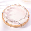 Delicate silver-toned crown headband wedding headdress with clear crystals and teardrop-shaped gems for brides
