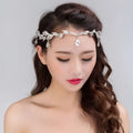 Golden crown headband wedding headdress with silver leaf pattern and dangling crystal teardrops for special occasions