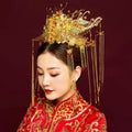 Golden ornate wedding chinese xiuhe headdress with red gemstones and dangling chains for bridal wear with ear clip