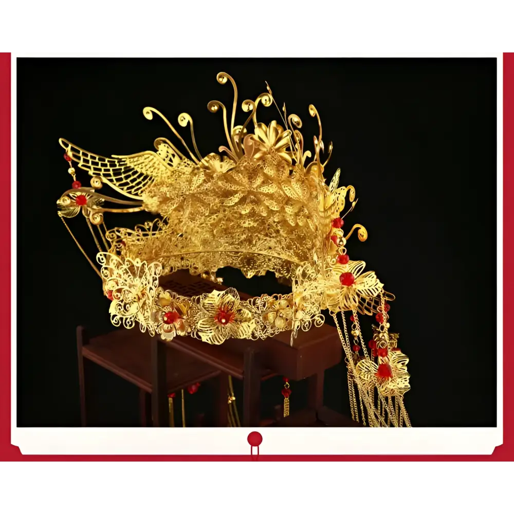 Golden ornate wedding chinese xiuhe headdress with filigree, red gemstones, floral designs, and ear clip