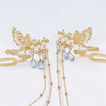 Golden phoenix hanfu female hairpin adorned with pearls and blue teardrop crystals for elegant wear