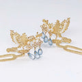 Golden phoenix hanfu female hairpin with intricate pearl details and blue teardrop beads for elegant hairstyles