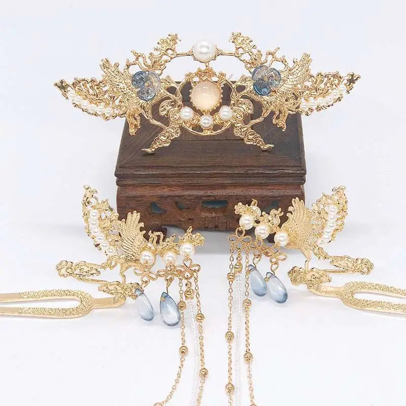 Golden phoenix hanfu female hairpin with ornate pearl embellishments and dangling blue teardrop stones