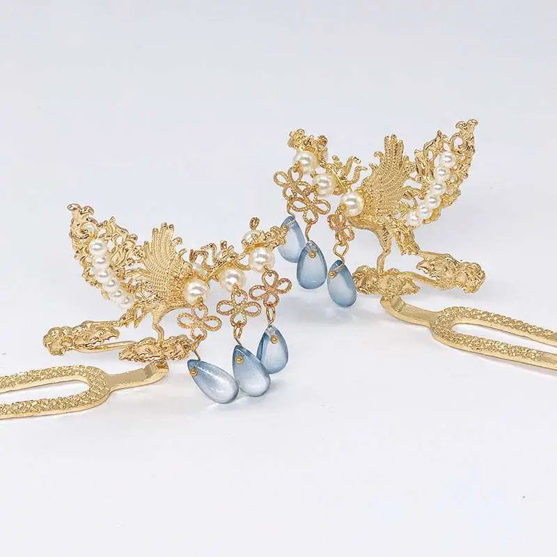 Golden phoenix hanfu female hairpin with intricate phoenix design, white pearls, and blue teardrop beads