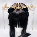 Golden phoenix hanfu female hairpin with intricate phoenix design, pearl embellishments, and blue teardrop crystals