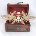 Golden phoenix hanfu female hairpin with intricate phoenix design, pearls, and central oval moonstone-like stone