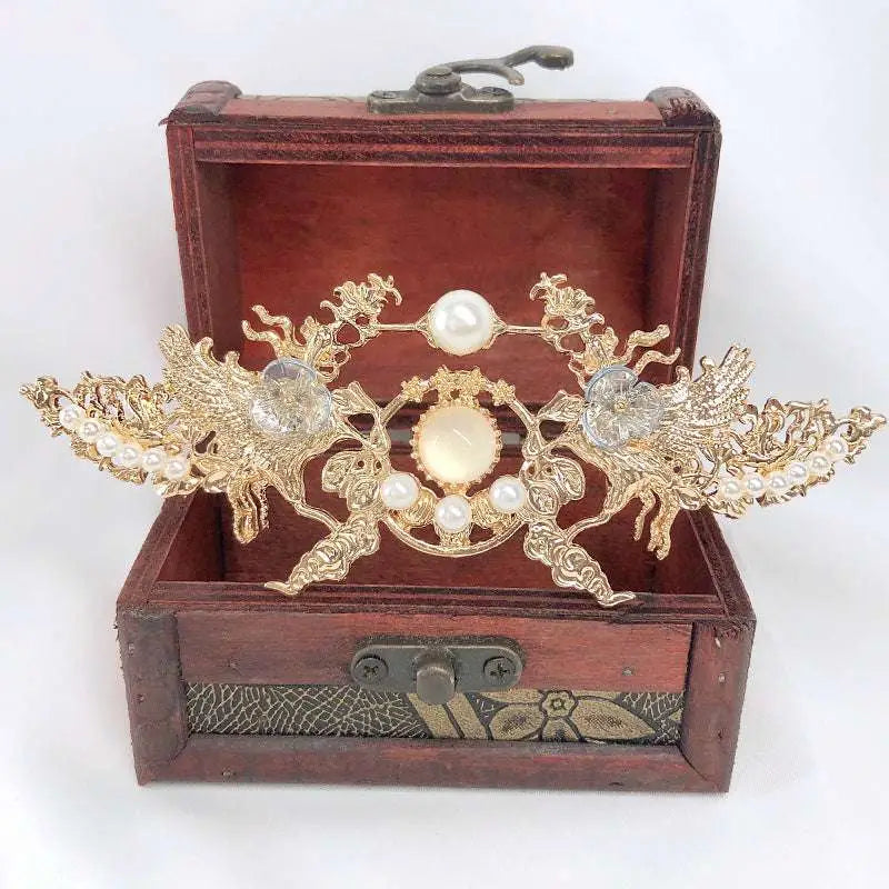 Golden phoenix hanfu female hairpin with intricate phoenix design, pearls, and central oval moonstone-like stone