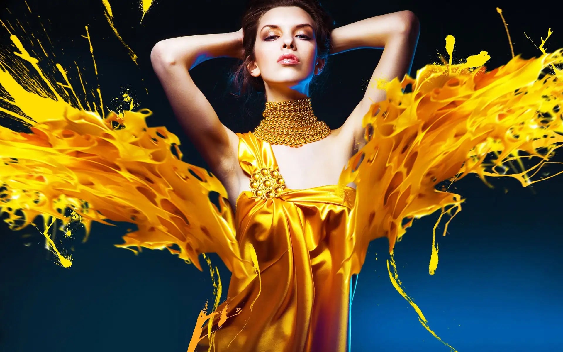 Golden satin gown with a central embellishment and matching gold choker necklace