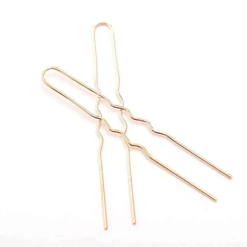 Gold-toned metal hairpins with a golden wavy metal design and sleek metallic finish for diy hair accessories
