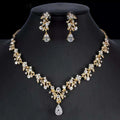 Gold-toned golden zircon jewelry set with intricate leaf and crystal designs featuring a bridal floral necklace and earrings