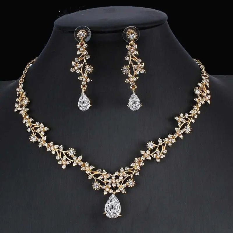 Golden zircon jewelry set featuring a gold-toned bridal floral necklace and matching zircon crystal drop earrings