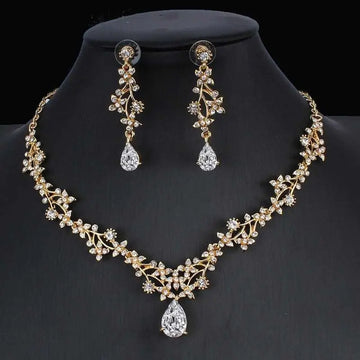 Golden zircon jewelry set featuring a gold-toned bridal floral necklace and matching zircon crystal drop earrings