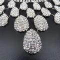 A sparkling silver teardrop rhinestone charm with clear crystals in a gorgeous diamond necklace set wedding bride accessory