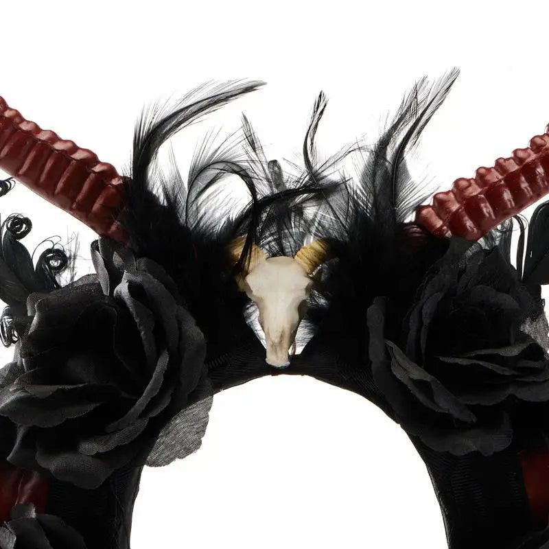 Gothic dark devil antelope horn headband in black and red with feathers faux flowers and a central devil horn skull