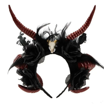 Gothic dark devil antelope horn headband in black and red with feathers faux flowers and a central devil horn skull