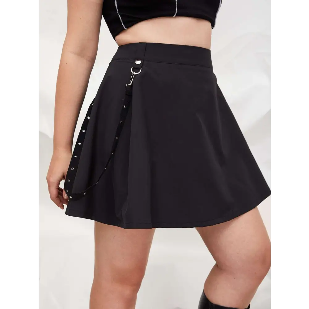 Black gothic pleated short skirt featuring metal hardware and leather straps with studded chain detail on the side
