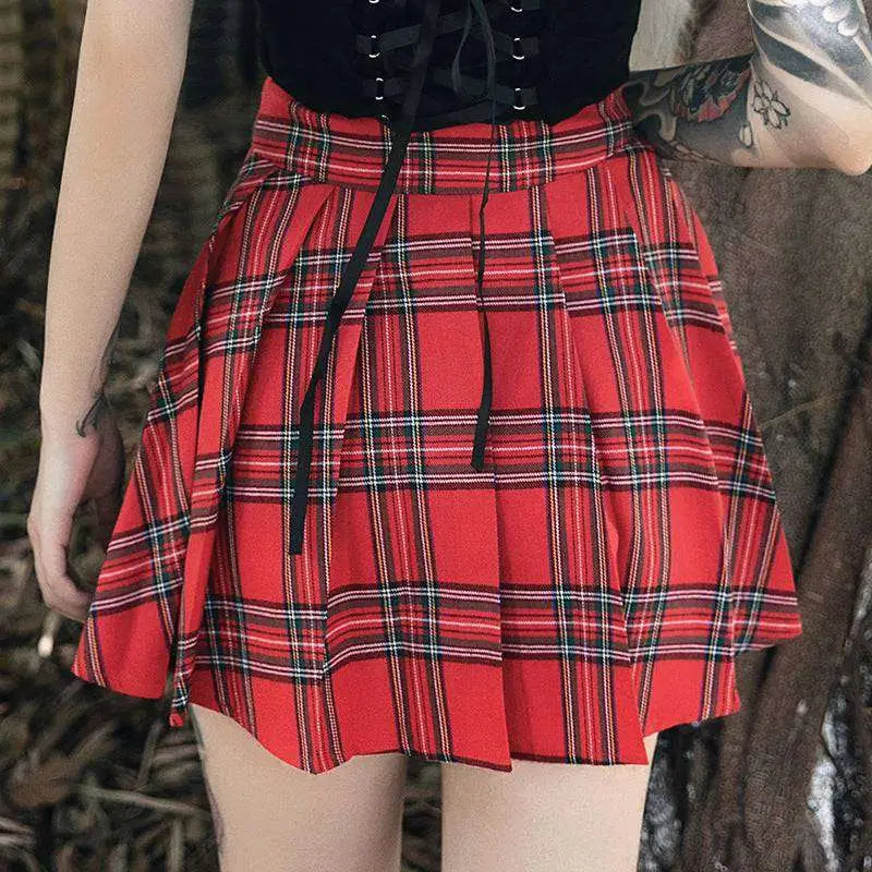 Gothic pleated short red plaid skirt with black and white stripes, gathered waistband, leather straps, and metal hardware